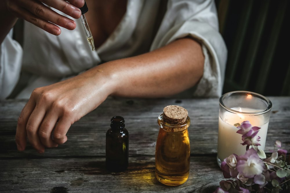 Amber bottles of natural oil on a wooden table